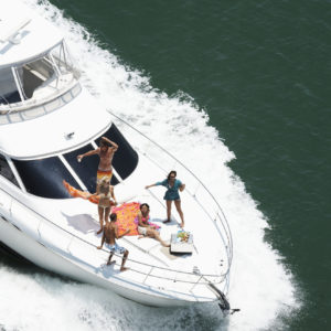 Group of people on speedboat at sea, aerial view