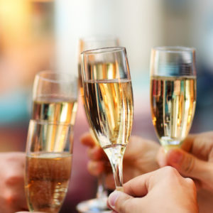 Celebration. People holding glasses of champagne making a toast