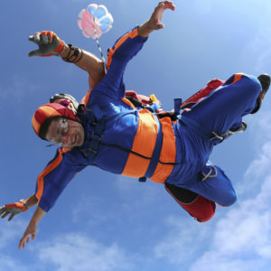 A tandem jump instructor and a passenger in a free fall.