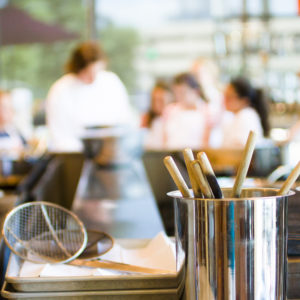 Kids learning how to cook in cooking school.