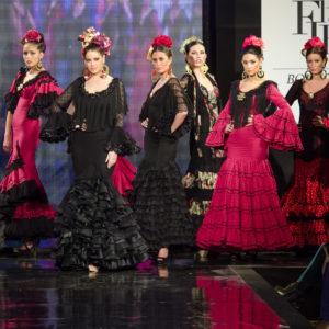 JEREZ DE LA FRONTERA, SPAIN - FEBRUARY 9: Models walk on the Carmen Vega catwalk during the Pasarela Flamenca Jerez 2014 Mercedes-Benz, In February 9, 2014 in Jerez de la Frontera, Spain