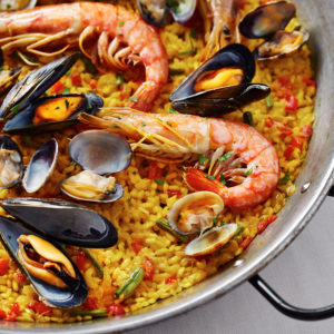 Typical spanish seafood paella in traditional pan