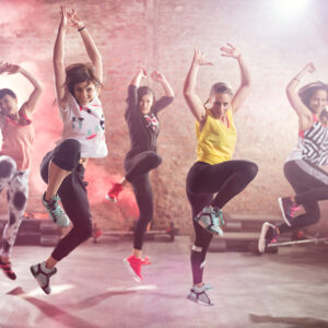 Group of fit young women dancing  and exercising