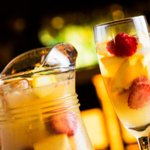 Champagne sangria called tisana in a night summer pub.