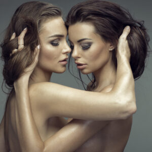 Portrait of two sexy woman hugging each other