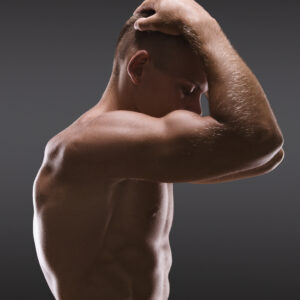 Healthy muscular young man posing.  Sport portrait.